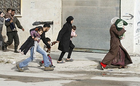 Syrian civilians flee fighting.jpg
