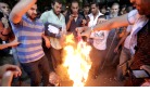 Egyptian protestors burn American flag.jpg
