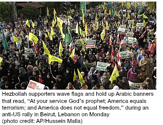 Hezbollah supporters wave flags.jpg