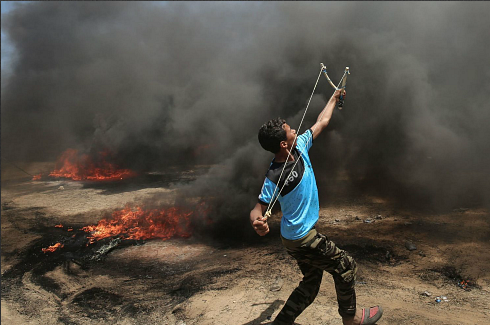 Palestinian using slingshot