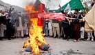 Afghans burning cross.jpg
