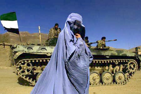 Burqa-wearing woman passes Afghan soldiers.jpg