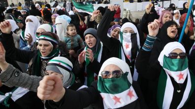 Syrian_women_in_Jordan_demonstrating_against_Bashar_al-Assad.jpg