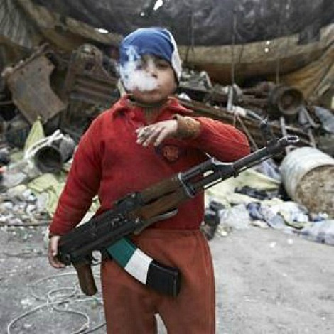 Syrian 7-yr old w/rifle.jpg