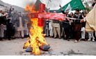 Afghans burning cross.jpg