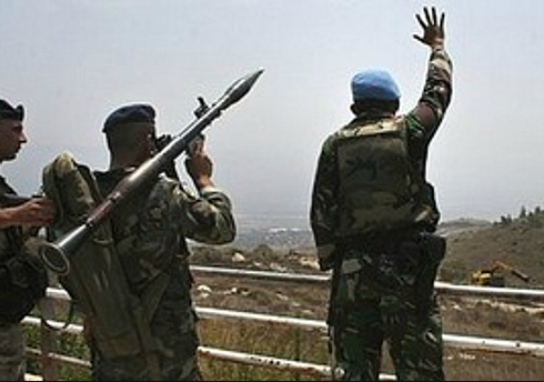 UNIFIL soldier waves 