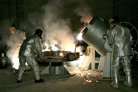 Iran-Technicians work inside Iranian uranium conversion facility.jpg