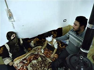 Syria-wounded girl w/parents #1(a).jpg
